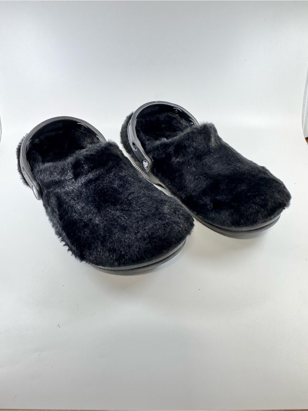 Crocs Classic Unfurgettable Clogs featuring a faux fur upper Color Black SZ 9